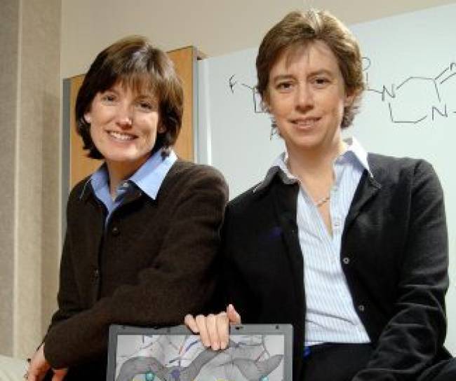 Scientists Thornberry and Weber smile at the camera