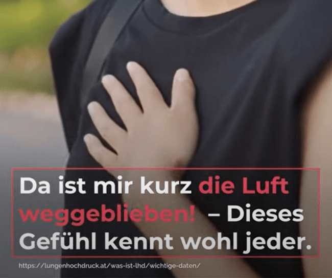 woman holds her hand over her heart