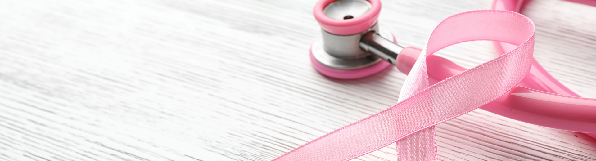 Stetoscope and pink ribbon on the table