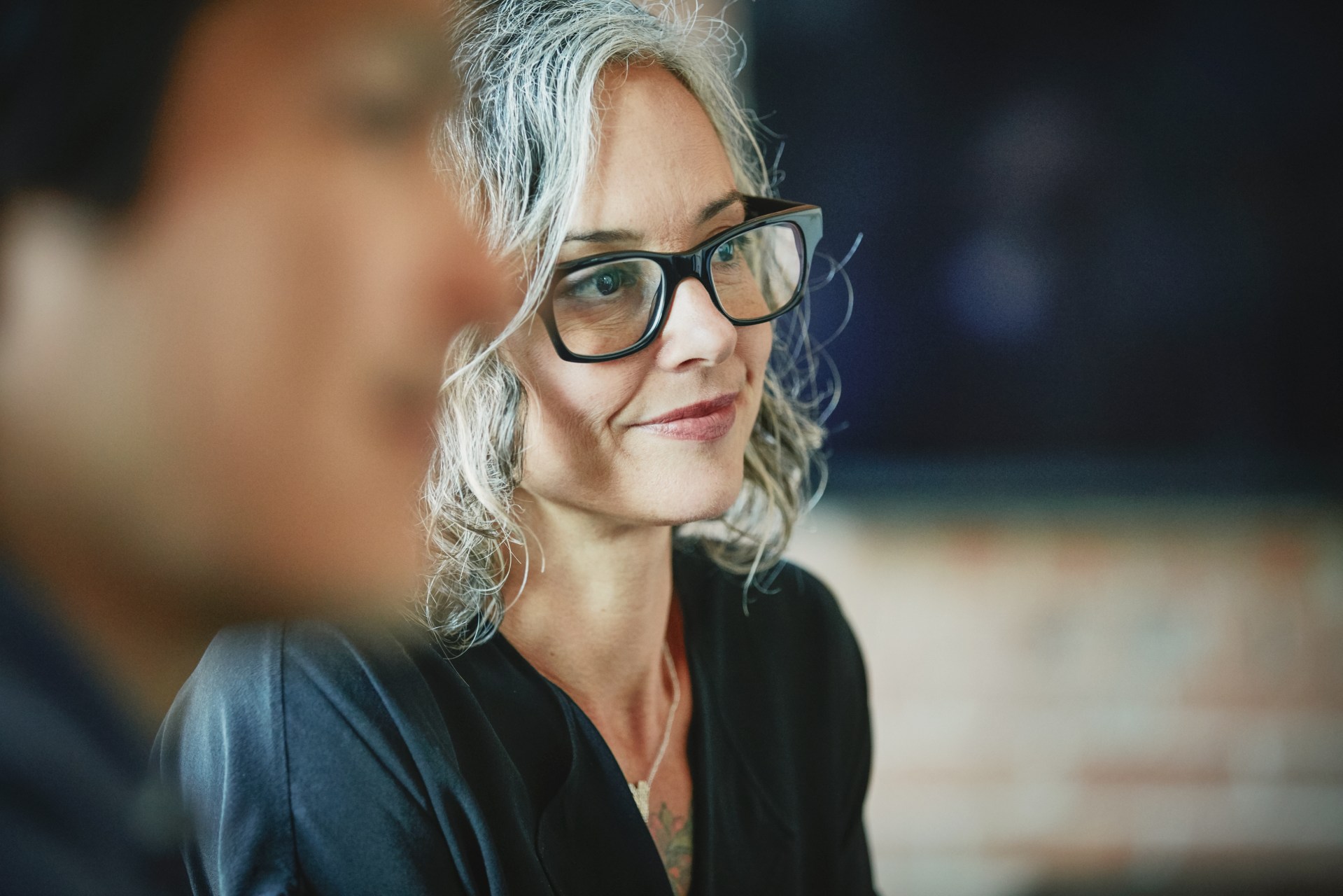 Close-up of a woman during a team meeting